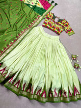 Load image into Gallery viewer, Luxurious Pista Green Printed Tussar Silk Lehenga Choli with Foil Work - Set of 3 ClothsVilla