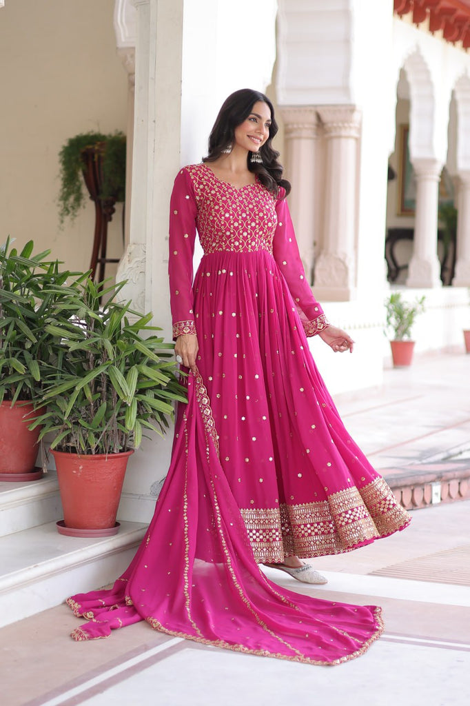 Rani Pink Rich Sequins & Zari Embroidered Faux Georgette Gown with Cut-Work Dupatta – Full Sleeves, Fancy V-Neck, Fully Stitched ClothsVilla