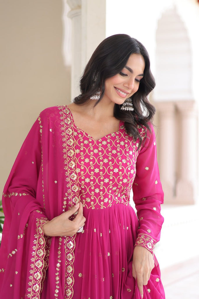Rani Pink Rich Sequins & Zari Embroidered Faux Georgette Gown with Cut-Work Dupatta – Full Sleeves, Fancy V-Neck, Fully Stitched ClothsVilla