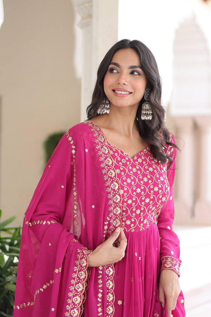 Rani Pink Rich Sequins & Zari Embroidered Faux Georgette Gown with Cut-Work Dupatta – Full Sleeves, Fancy V-Neck, Fully Stitched ClothsVilla