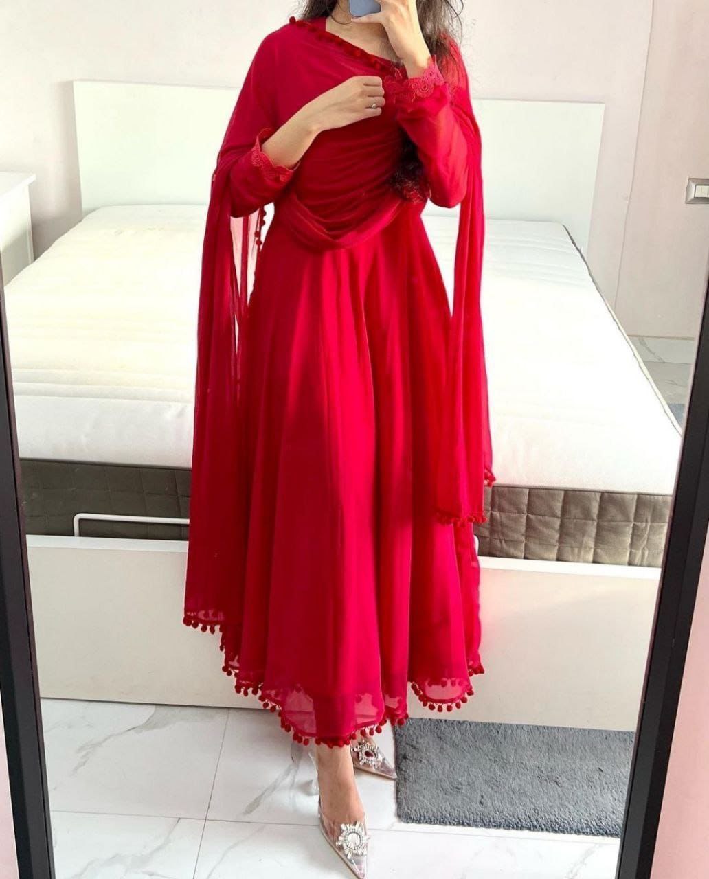 Red Heavy Georgette Gown with Pom Pom Work, Potli Buttons and Chudidar Sleeves ClothsVilla