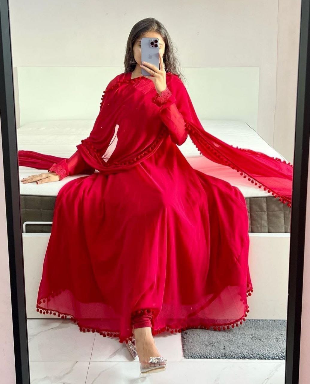 Red Heavy Georgette Gown with Pom Pom Work, Potli Buttons and Chudidar Sleeves ClothsVilla