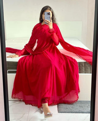 Red Heavy Georgette Gown with Pom Pom Work, Potli Buttons and Chudidar Sleeves ClothsVilla