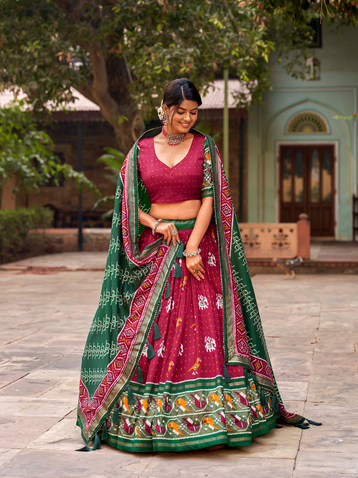 Red Tussar Silk Lehenga Choli with Enchanting Ikat Patola Print and Foil Work ClothsVilla Main image