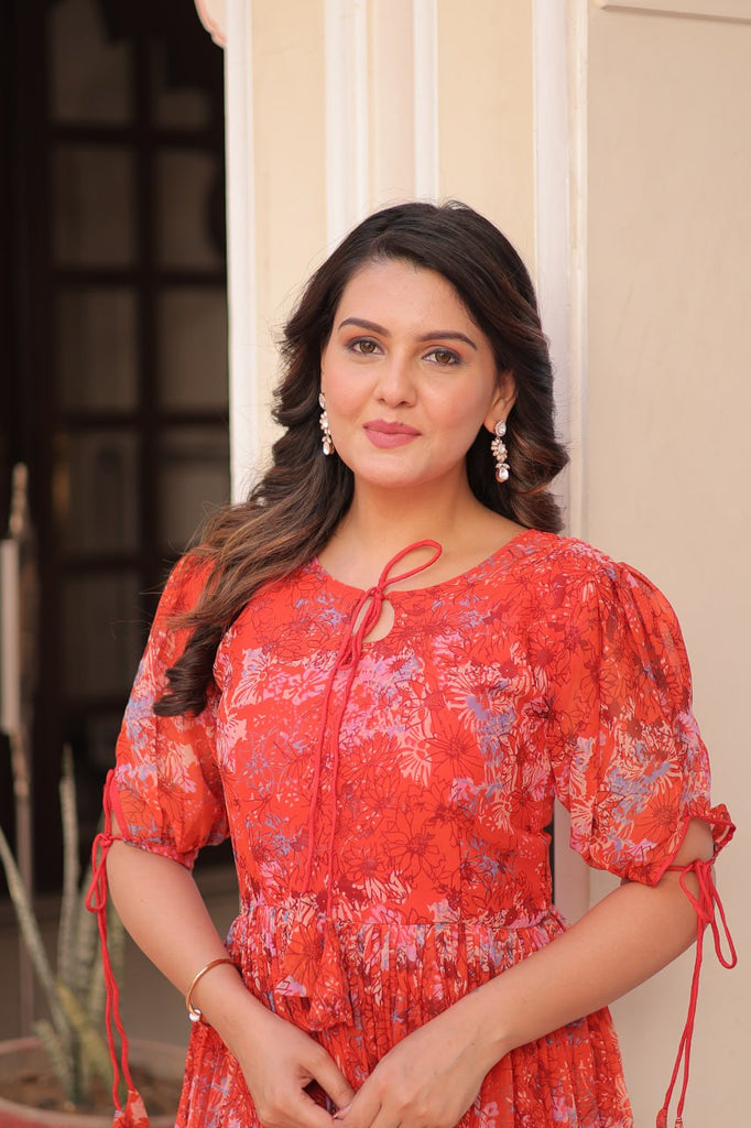 Rust Printed Faux Georgette Anarkali Gown with 7-Meter Flair and Bell Sleeves ClothsVilla