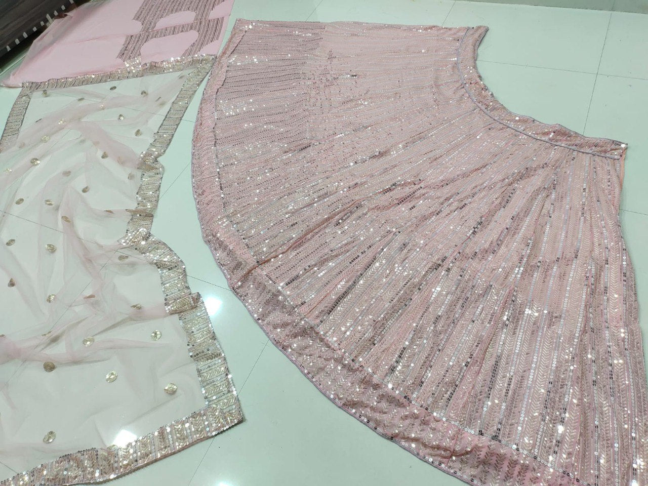 Sequined Georgette Pink Lehenga Set with Net Dupatta ClothsVilla Main image