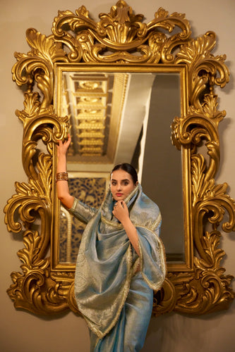 Sky Blue Elegant Tissue Shimmer Saree with Zari Weaving and Sequins Lace Border ClothsVilla