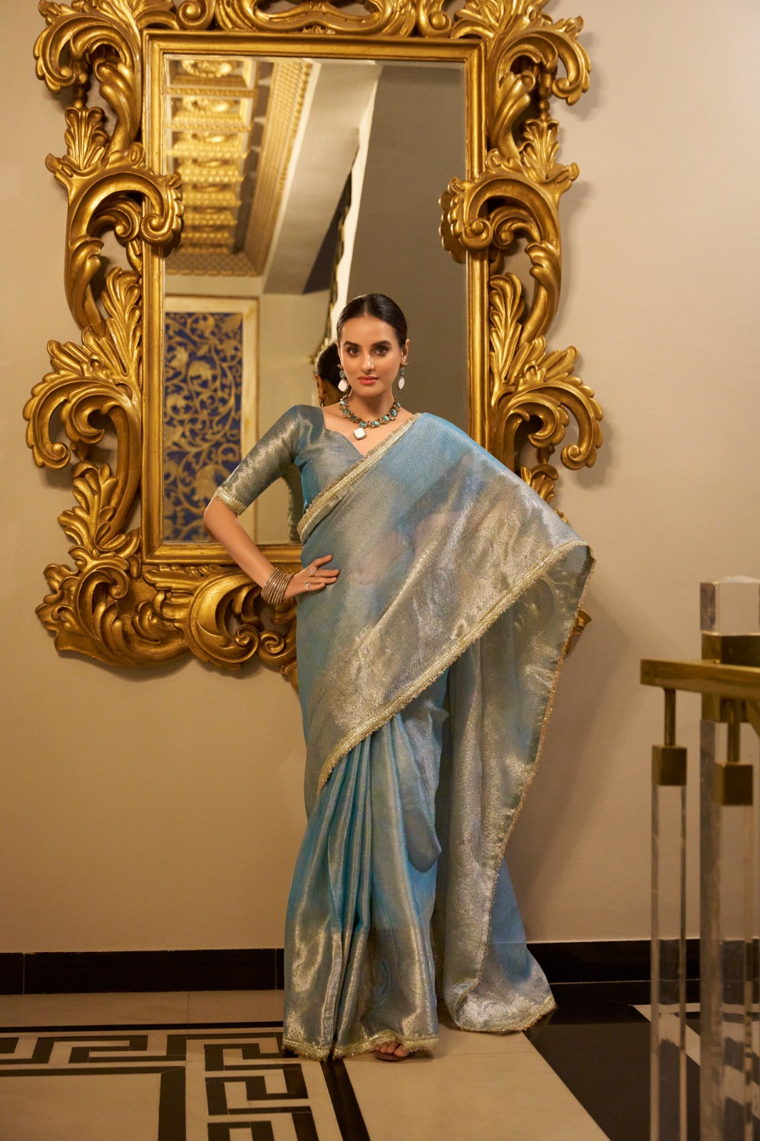 Sky Blue Elegant Tissue Shimmer Saree with Zari Weaving and Sequins Lace Border ClothsVilla Main image