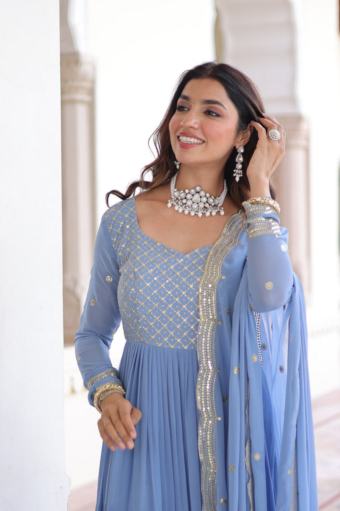 Sky Blue Royal Faux Georgette Embroidered Gown with Sequins & Zari Work – Three-Layer Frill Stitched Gown with Cotton Lining and Matching Dupatta ClothsVilla