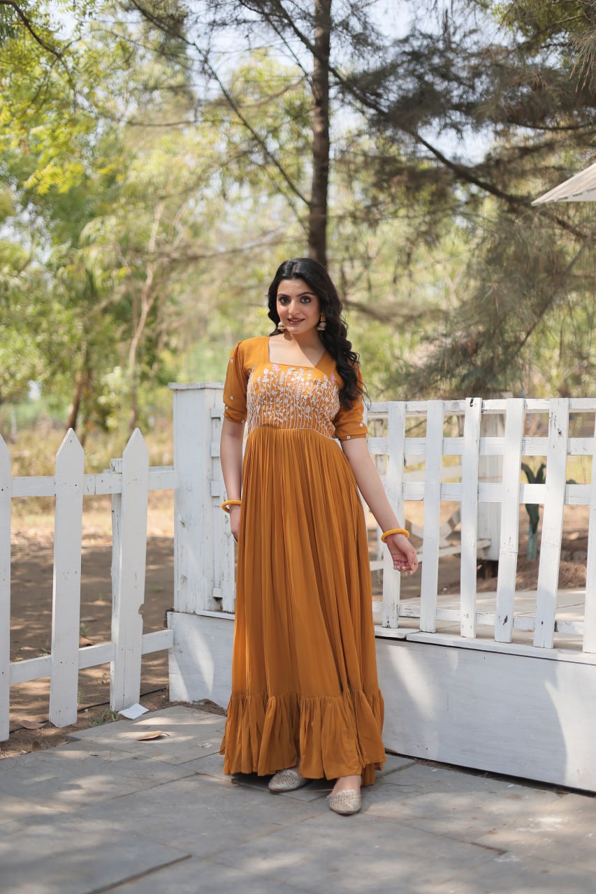 Sparkling Multithreaded Embroidered Faux Georgette Mustard Yellow Gown with Puff Sleeves ClothsVilla