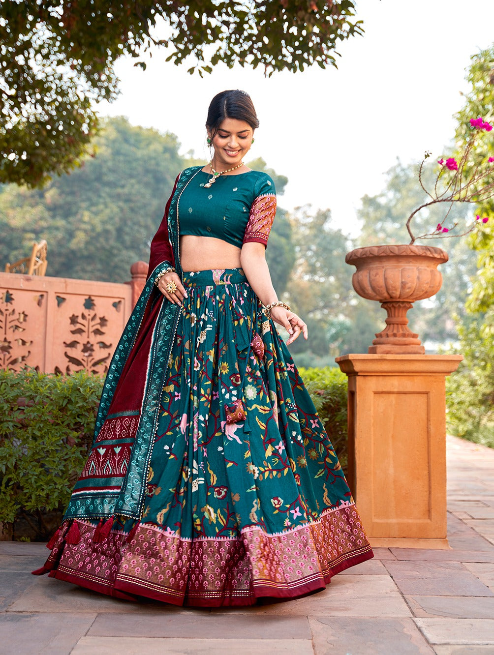 Teal Color Mesmerize in Dola Silk Elegance Printed Lehenga Choli Set with Foil Work & Minakari ClothsVilla