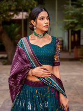 Load image into Gallery viewer, Teal Tussar Silk Lehenga Choli with Enchanting Ikat Patola Print and Foil Work ClothsVilla