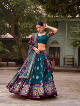 Load image into Gallery viewer, Teal Tussar Silk Lehenga Choli with Enchanting Ikat Patola Print and Foil Work ClothsVilla