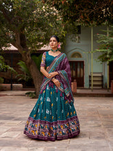 Load image into Gallery viewer, Teal Tussar Silk Lehenga Choli with Enchanting Ikat Patola Print and Foil Work ClothsVilla