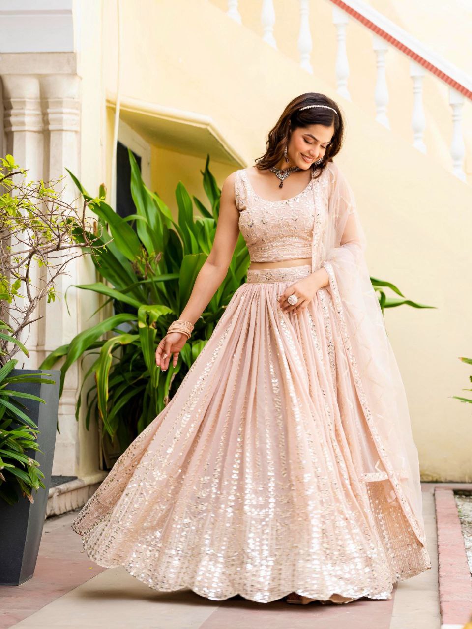 Warm Peach Luxurious Faux Georgette Zari & Sequin Embroidered Semi-Stitched Lehenga Choli with Net Embroidered Dupatta ClothsVilla
