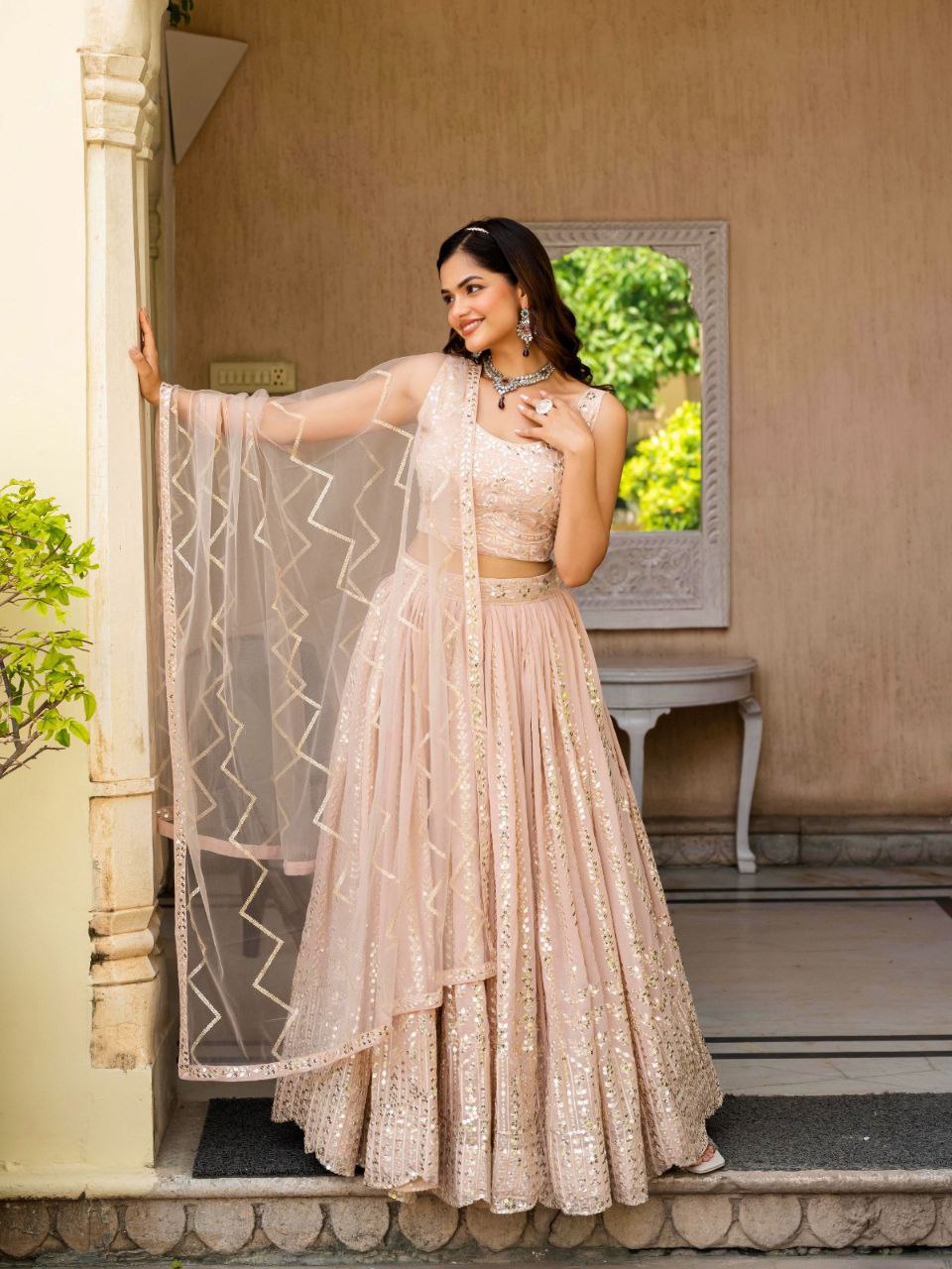 Warm Peach Luxurious Faux Georgette Zari & Sequin Embroidered Semi-Stitched Lehenga Choli with Net Embroidered Dupatta ClothsVilla