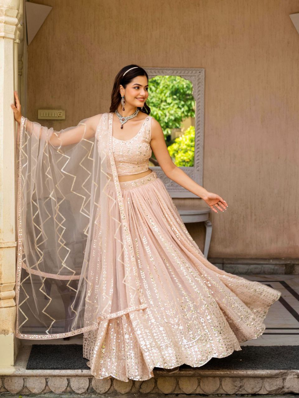 Warm Peach Luxurious Faux Georgette Zari & Sequin Embroidered Semi-Stitched Lehenga Choli with Net Embroidered Dupatta ClothsVilla