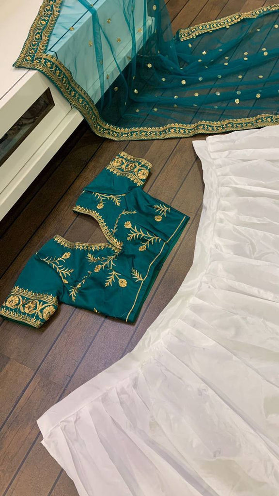 White Elegant Tapeta Silk Lehenga with Pearl & Embroidery Work ClothsVilla