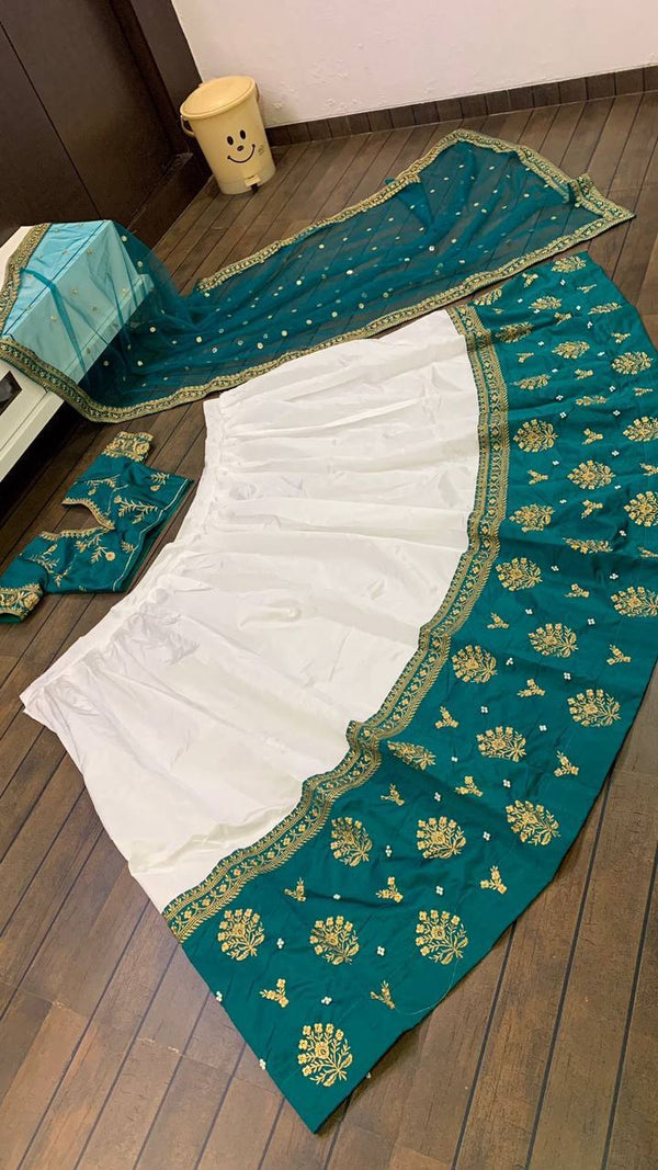 White Elegant Tapeta Silk Lehenga with Pearl & Embroidery Work ClothsVilla