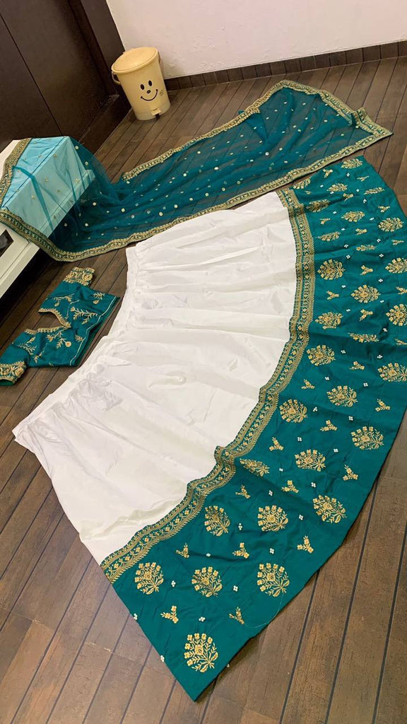 White Elegant Tapeta Silk Lehenga with Pearl & Embroidery Work ClothsVilla