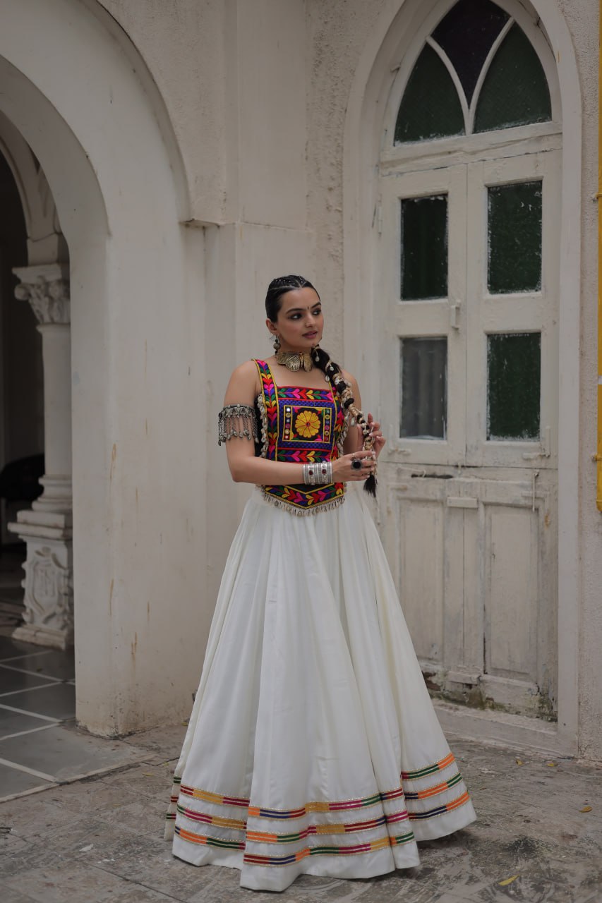 White Festive Roman Fabric Lehenga with black Kutchi Gamthi Embroidered Top ClothsVilla