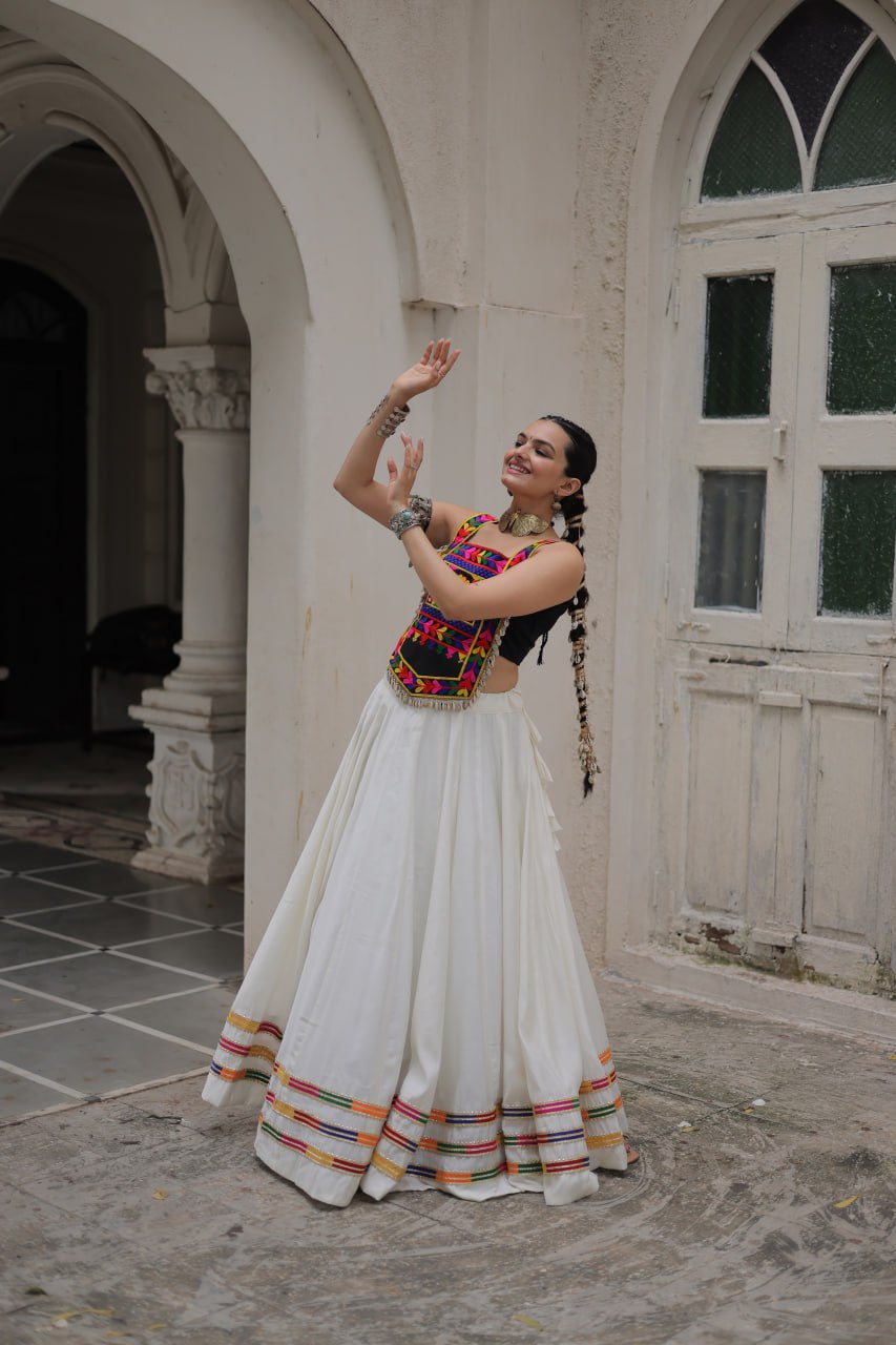 White Festive Roman Fabric Lehenga with black Kutchi Gamthi Embroidered Top ClothsVilla