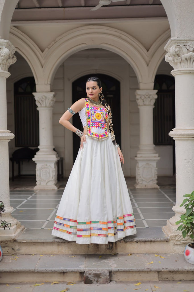 White Festive Roman Fabric Lehenga with Kutchi Gamthi Embroidered Top ClothsVilla
