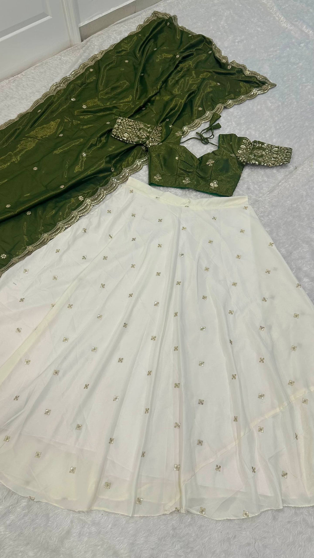 White Pure Crepe Silk Lehenga with Sequins & Zari Work and Shimmer Silk Green Dupatta ClothsVilla