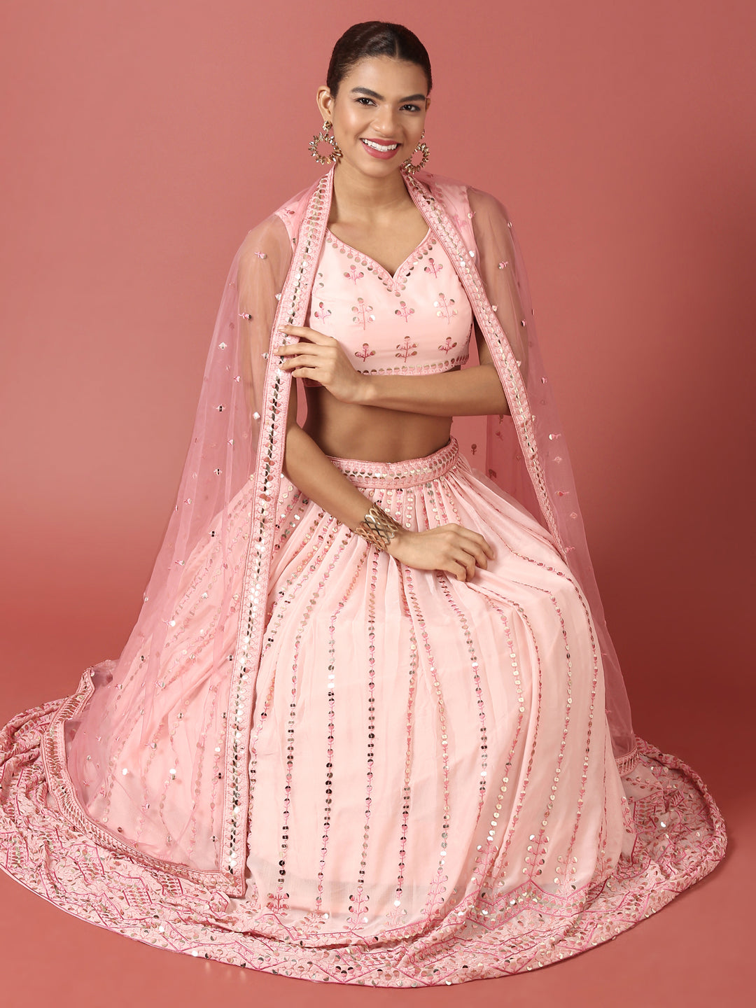 Women Peach Net Sequinse Embroidered Semi-Stitched Lehenga & Blouse with Dupatta Clothsvilla