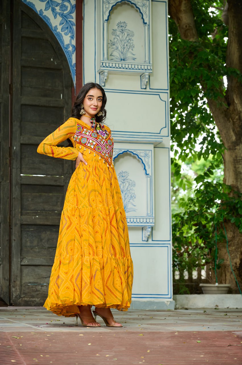 Yellow Bandhani Print Faux Georgette Gown with Kutchi Patchwork – Full Sleeves, 9 Meter Flair, Cotton Lining ClothsVilla