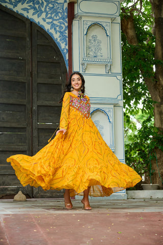 Yellow Bandhani Print Faux Georgette Gown with Kutchi Patchwork – Full Sleeves, 9 Meter Flair, Cotton Lining ClothsVilla