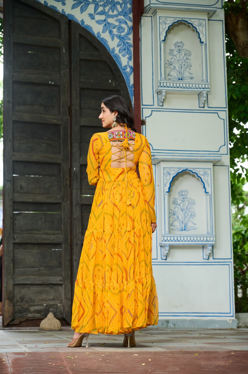 Yellow Bandhani Print Faux Georgette Gown with Kutchi Patchwork – Full Sleeves, 9 Meter Flair, Cotton Lining ClothsVilla