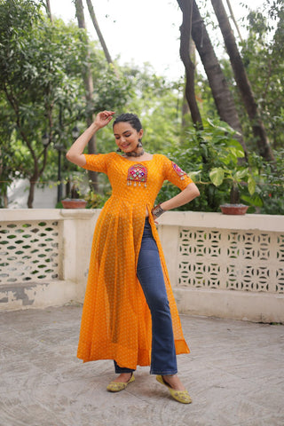Yellow Bandhani Print Kurti with Kutchi Patchwork Detailing ClothsVilla