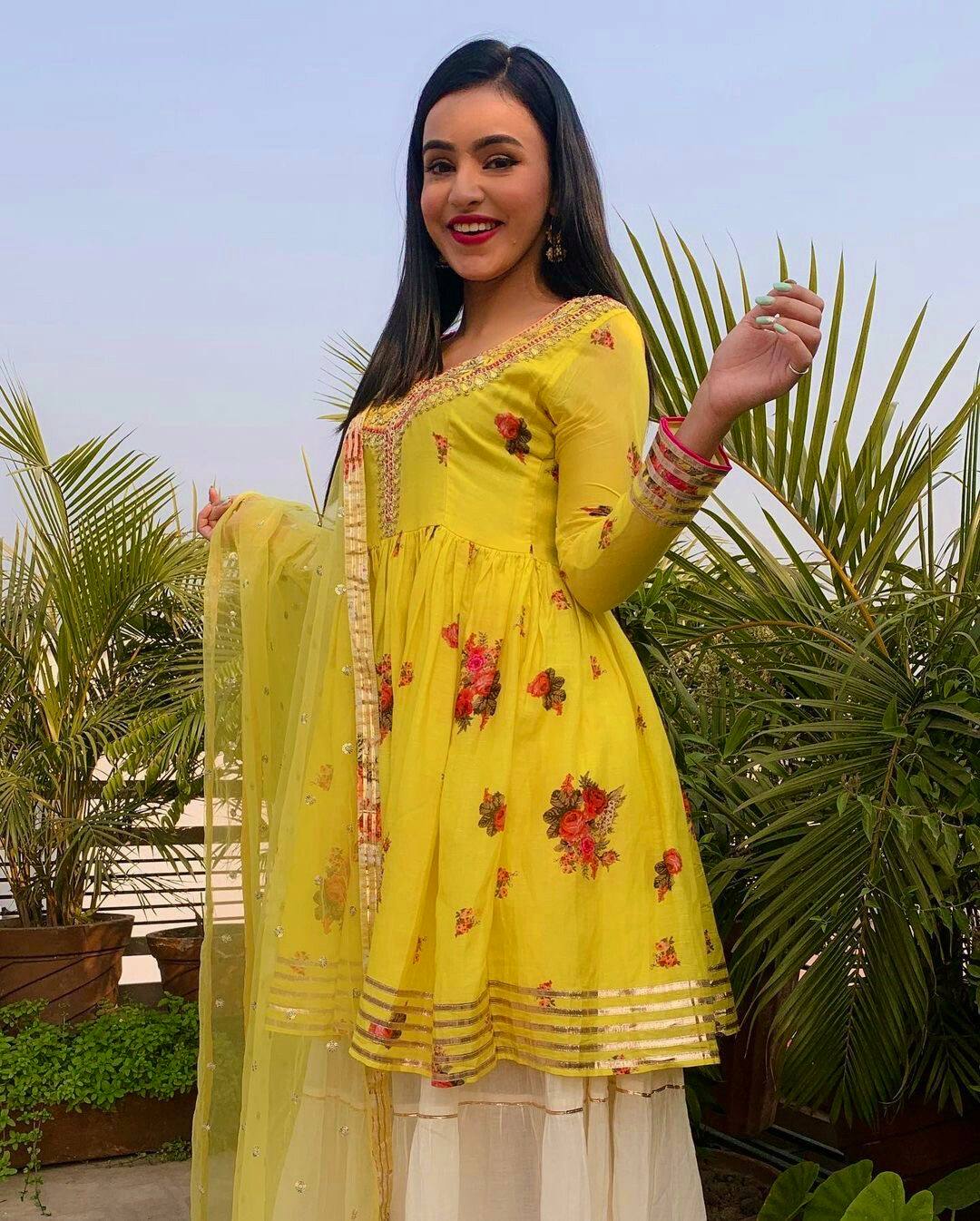 Yellow Elegant Crepe Silk Digital Print Top with Rayon Sharara & Embroidered Net Dupatta ClothsVilla