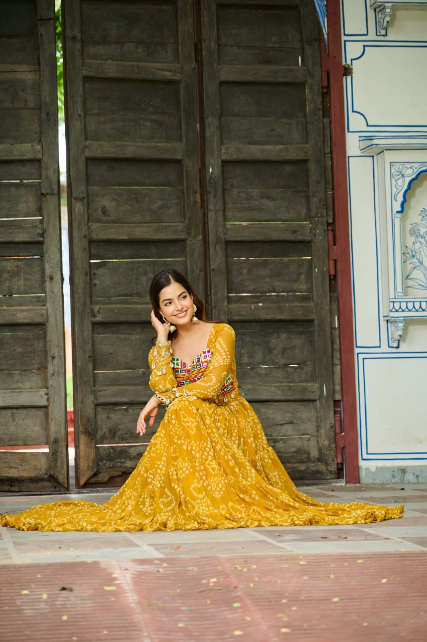 Yellow Faux Georgette Bandhani Print Gown with Kutchi Patchwork – Full Sleeves, 12 Meter Flair, Cotton Lining ClothsVilla