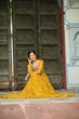 Load image into Gallery viewer, Yellow Faux Georgette Bandhani Print Gown with Kutchi Patchwork – Full Sleeves, 12 Meter Flair, Cotton Lining ClothsVilla