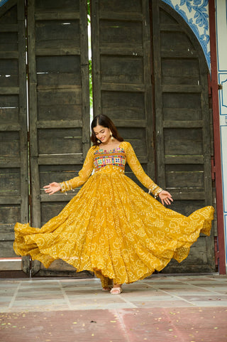 Yellow Faux Georgette Bandhani Print Gown with Kutchi Patchwork – Full Sleeves, 12 Meter Flair, Cotton Lining ClothsVilla
