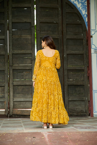Yellow Faux Georgette Bandhani Print Gown with Kutchi Patchwork – Full Sleeves, 12 Meter Flair, Cotton Lining ClothsVilla