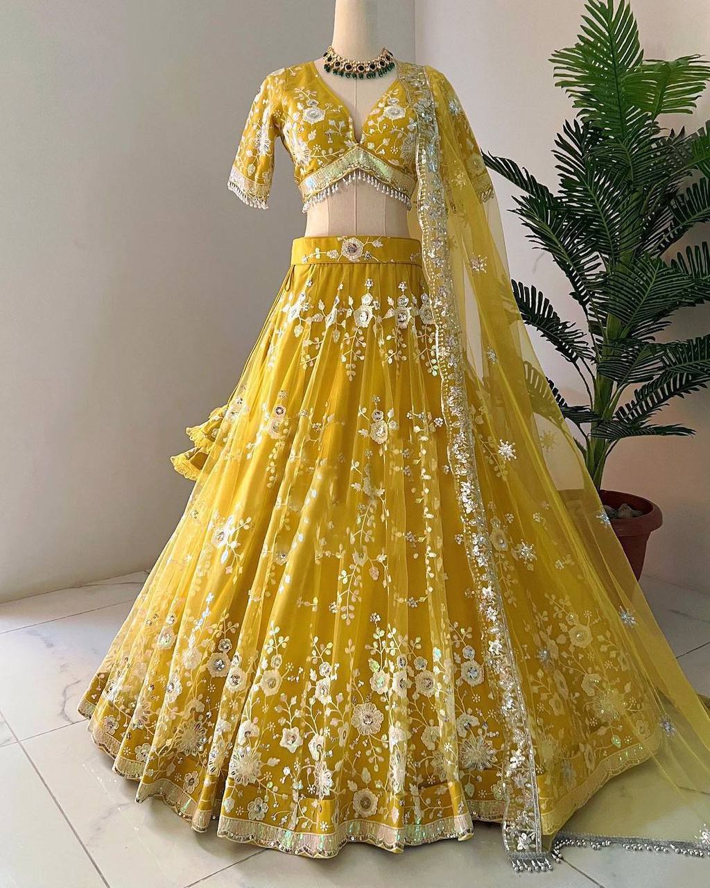 Yellow Radiant Soft Net Semi-Stitched Lehenga Set with Sequence Embroidery & Fancy Latkans ClothsVilla