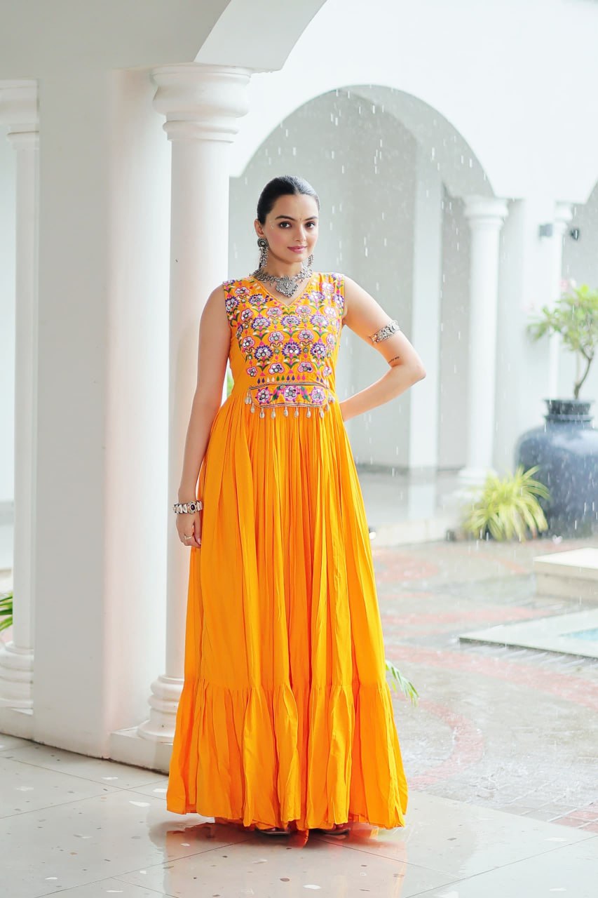 Yellow Rayon Navratri Gown with Kutchi Gamthi Embroidery & Mirror Work – Sleeveless with Flair ClothsVilla