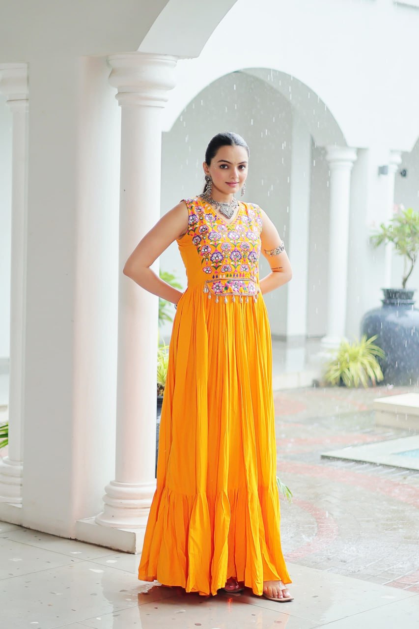 Yellow Rayon Navratri Gown with Kutchi Gamthi Embroidery & Mirror Work – Sleeveless with Flair ClothsVilla
