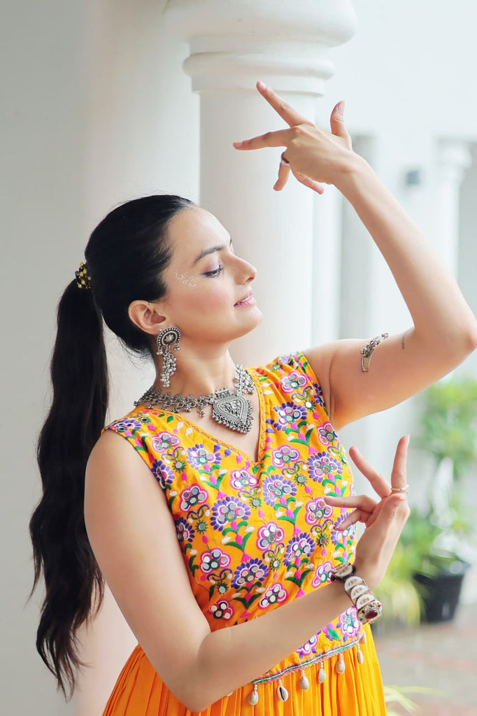 Yellow Rayon Navratri Gown with Kutchi Gamthi Embroidery & Mirror Work – Sleeveless with Flair ClothsVilla