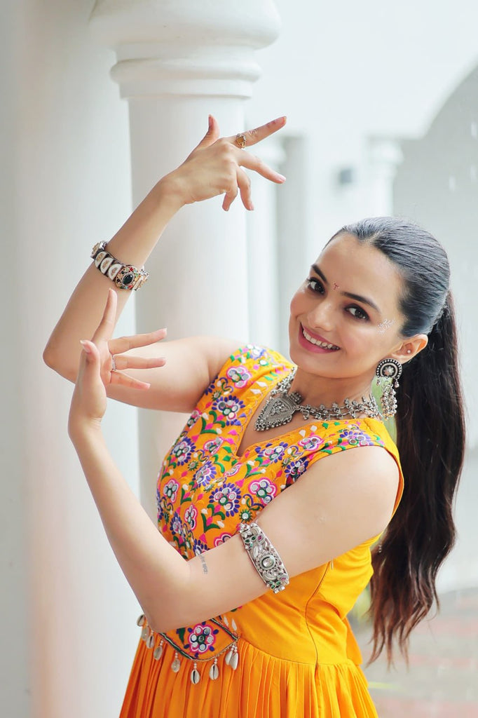 Yellow Rayon Navratri Gown with Kutchi Gamthi Embroidery & Mirror Work – Sleeveless with Flair ClothsVilla