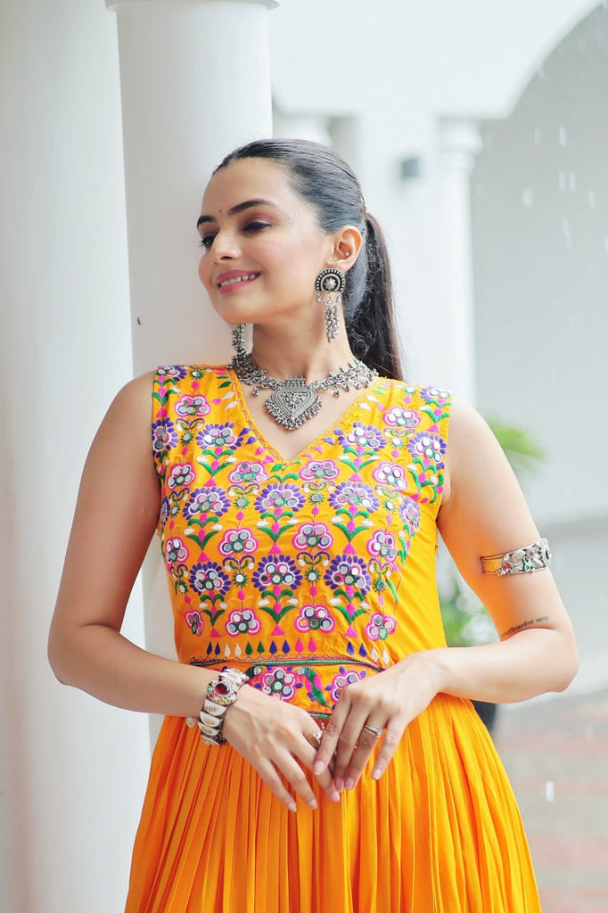 Yellow Rayon Navratri Gown with Kutchi Gamthi Embroidery & Mirror Work – Sleeveless with Flair ClothsVilla
