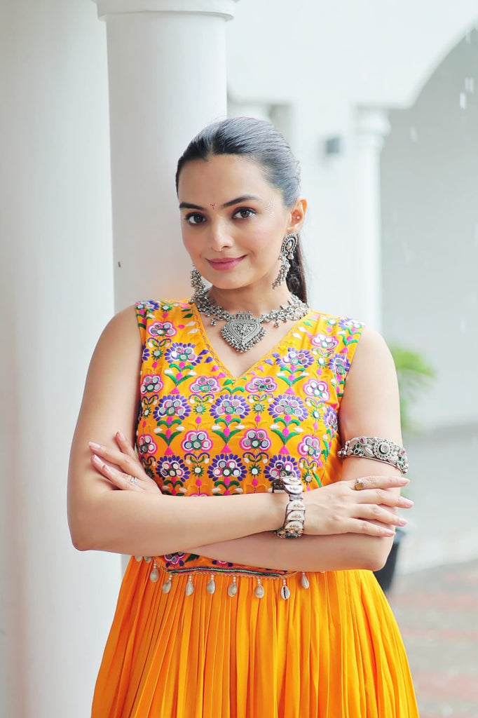 Yellow Rayon Navratri Gown with Kutchi Gamthi Embroidery & Mirror Work – Sleeveless with Flair ClothsVilla