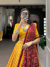 Load image into Gallery viewer, Yellow Tussar Silk Lehenga Choli with Leheriya Print, Patola Border &amp; Bandhani Dupatta ClothsVilla