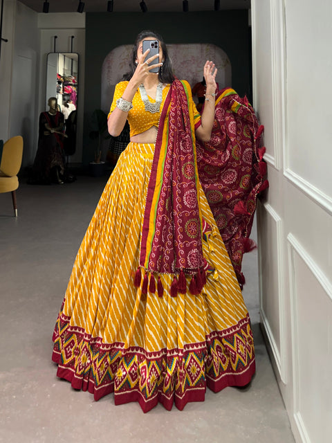 Yellow Tussar Silk Lehenga Choli with Leheriya Print, Patola Border & Bandhani Dupatta ClothsVilla Main image