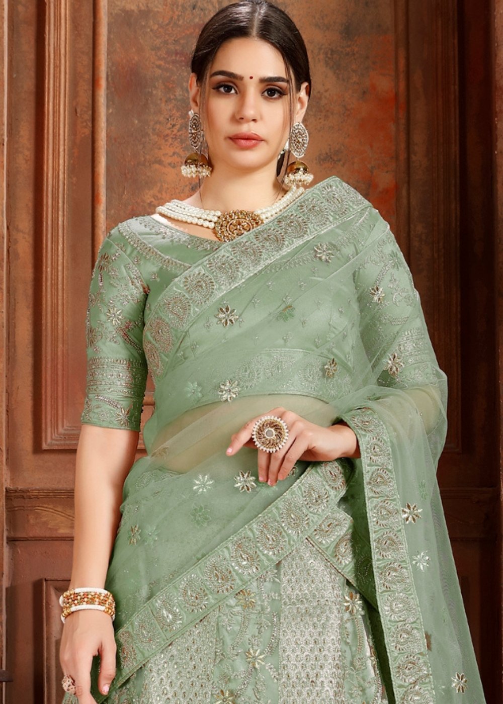 Pista Green Soft Net Lehenga Choli with Thread,Zari, Zarkan & Pearl work Clothsvilla