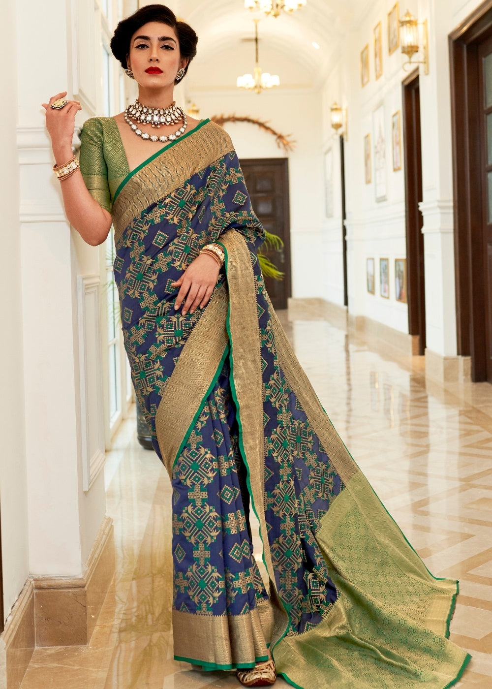 Light Blue Patola Silk Saree with Golden Border Clothsvilla