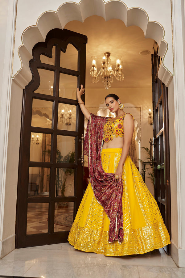 Yellow With Maroon Color Embroidered Semi Stitched Bridal Lehenga Choli Clothsvilla